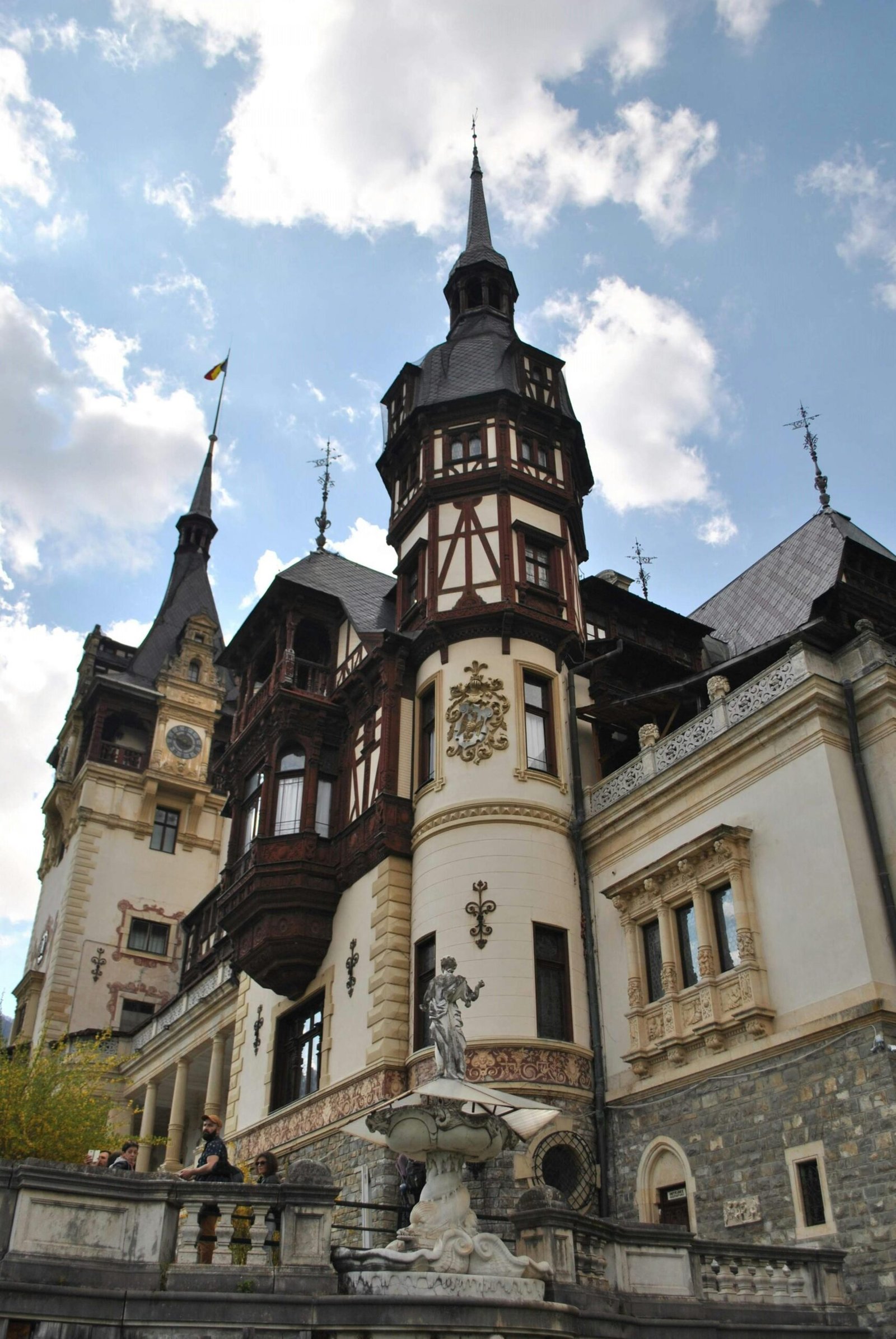 Stunning view of Peles Castle with clear sky in Romania.